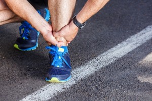 Man with running sport injury Achilles tendonitis